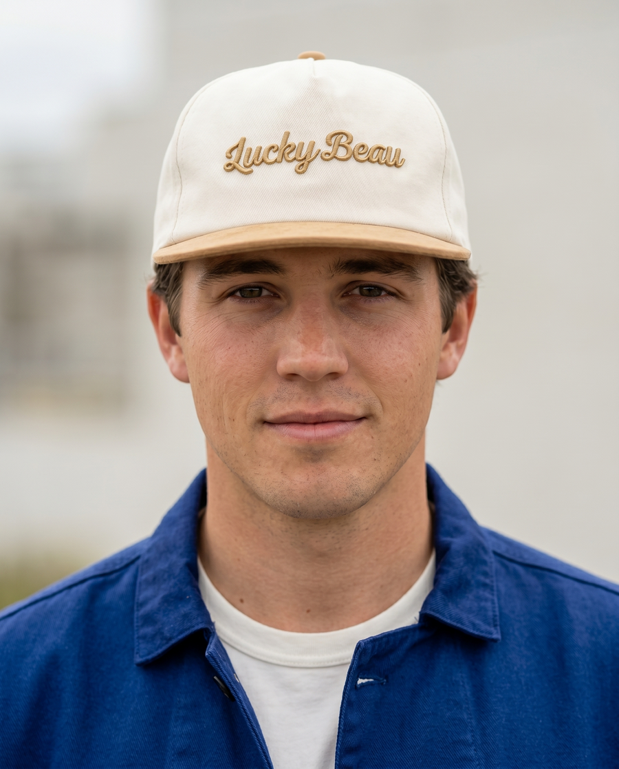Portrait of a man wearing the Lucky Beau cap with the Chasseur Bleu jacket